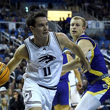 Nevada’s Nick Davidson looks to pass while taking on South Dakota State at Lawlor Events Center in Reno on Dec. 11, 2024.