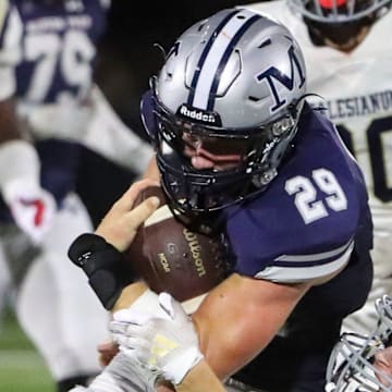 Salesianum's Jett Healy drags down Malvern Prep's Jake Bauer after a gain in the second half of Malvern Prep's 27-3 win at Abessinio Stadium, Friday, Sept. 20, 2024.