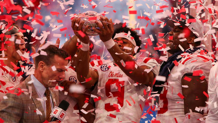 Dec 30, 2023; Atlanta, GA, USA; Mississippi Rebels wide receiver Tre Harris (9) holds up the Peach Bowl trophy after a victory against the Penn State Nittany Lions at Mercedes-Benz Stadium. Mandatory Credit: Brett Davis-USA TODAY Sports
