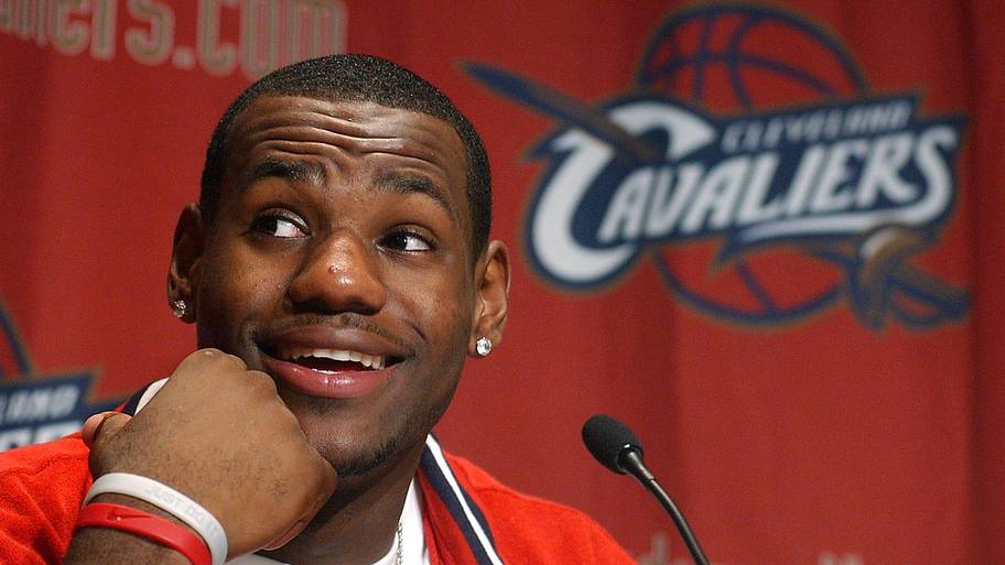 LeBron James answers questions from throng of media members gathered after he worked out for the Cavaliers in 2003.