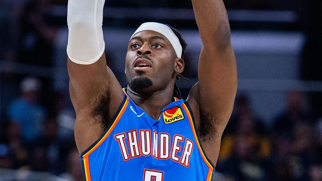 Oct 23, 2025; Indianapolis, Indiana, USA; Oklahoma City Thunder guard Luguentz Dort (5) shoots the ball in the first half against the Indiana Pacers at Gainbridge Fieldhouse. Mandatory Credit: Trevor Ruszkowski-Imagn Images