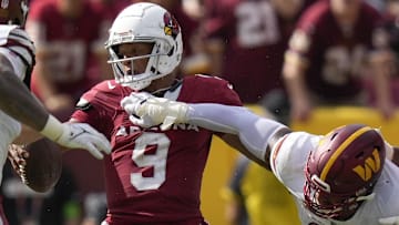 Sep 10, 2023; Landover, Maryland, USA; Arizona Cardinals quarterback Joshua Dobbs (9) is hit by