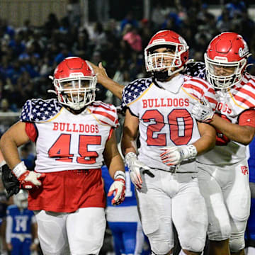 Oak Hill's Jacob Macias, center-right, walks off the field after sacking the Beaumont quarterback on Friday, Sept. 13, 2024. Oak Hills beat Beaumont 28-19, improving to 4-0 on the season.