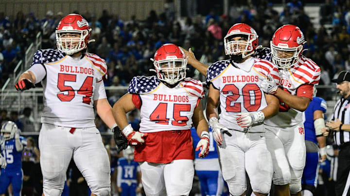 Oak Hill's Jacob Macias, center-right, walks off the field after sacking the Beaumont quarterback on Friday, Sept. 13, 2024. Oak Hills beat Beaumont 28-19, improving to 4-0 on the season.