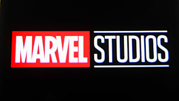 In this photo illustration a Marvel Studios logo is seen on...