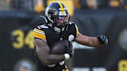 Dec 8, 2024; Pittsburgh, Pennsylvania, USA;  Pittsburgh Steelers running back Jaylen Warren (30) rushes the ball against the Cleveland Browns during the second quarter at Acrisure Stadium. Mandatory Credit: Charles LeClaire-Imagn Images