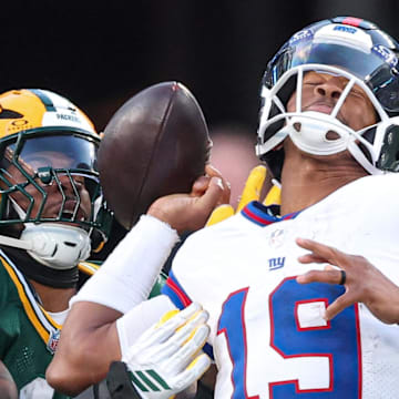 Green Bay Packers defensive end Micah Parsons (1) strip sacks New York Giants quarterback Jameis Winston.