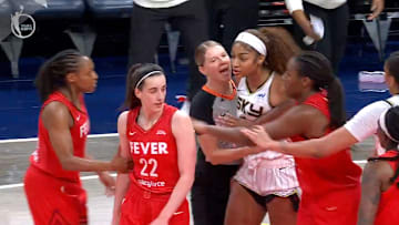 Reese had to be held back from Clark.