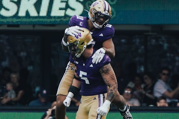 Zach Durfee has Alphonzo Tuputala jumping on his back after a big play.