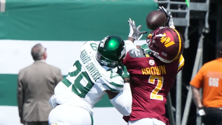 East Rutherford, NJ -- August 10, 2024 -- Carrick Bernard-Converse of the Jets canÕt prevent this long reception by Dyami Brown of the Commanders as the Washington Commanders came to MetLife Stadium to play the New York Jets in the first press season game of the 2024 season.