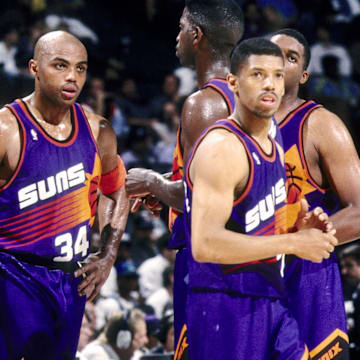 Kevin Johnson, right, with Suns teammates including Charles Barkley