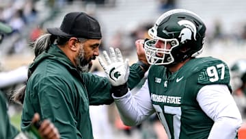 Michigan State's Maverick Hansen, right, works with defensive line coach Legi Suiaunoa during the Spring Showcase on Saturday, April 20, 2024, at Spartan Stadium in East Lansing.