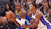 Oct 9, 2024; Sacramento, California, USA; Sacramento Kings forward Keegan Murray (13) defends against Golden State Warriors forward Jonathan Kuminga (00) during the first quarter at Golden 1 Center. Mandatory Credit: Ed Szczepanski-Imagn Images