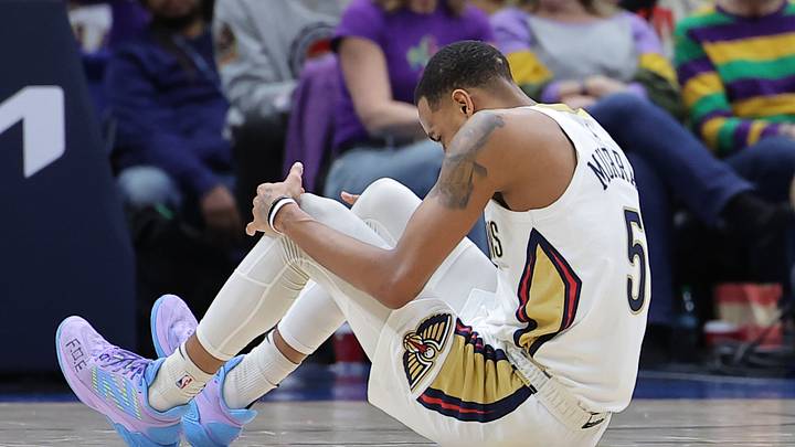 Dejounte Murray #5 of the New Orleans Pelicans injures himself against the Boston Celtics.