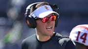 Sep 27, 2025; Champaign, Illinois, USA;  Southern California Trojans head coach Lincoln Riley talks with players during the first half against the Illinois Fighting Illini  at Memorial Stadium. Mandatory Credit: Ron Johnson-Imagn Images