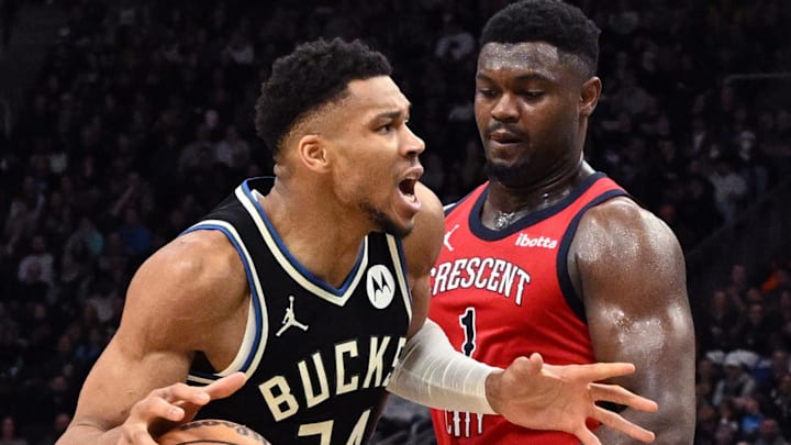 Jan 27, 2024; Milwaukee, Wisconsin, USA; Milwaukee Bucks forward Giannis Antetokounmpo (34) drives against New Orleans Pelicans forward Zion Williamson (1) in the second half at Fiserv Forum. Mandatory Credit: Michael McLoone-Imagn Images