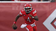Utah Utes quarterback Devon Dampier (4) runs the ball against the Cal Poly Mustangs during the first quarter at Rice-Eccles Stadium.