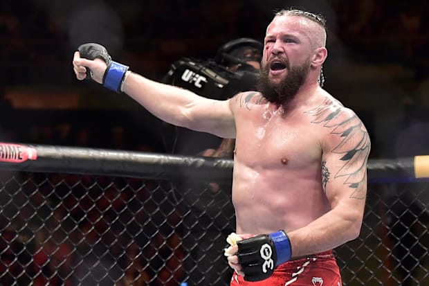 Nicolas Dalby (blue gloves) reacts after defeating Gabriel Bonfim (not pictured) during a UFC Fight Night at Ibirapuera Arena