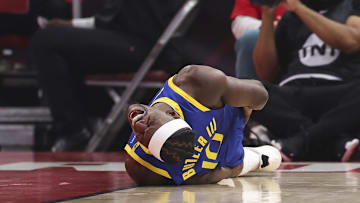 Golden State Warriors forward Jimmy Butler III suffers an apparent injury during the first quarter.