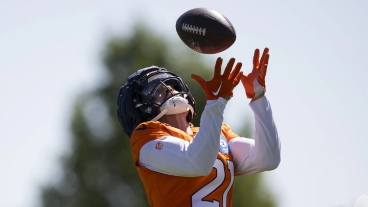 Denver Broncos cornerback Riley Moss catches a pass during training camp practice. 