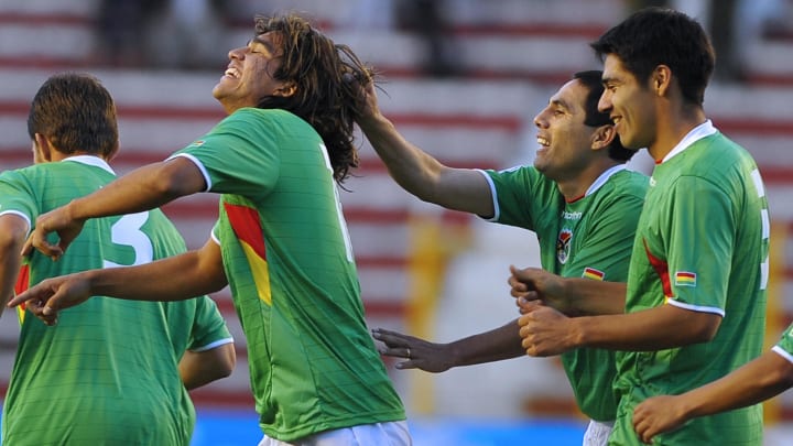 Bolivia's Marcelo Martins(L) is congratu