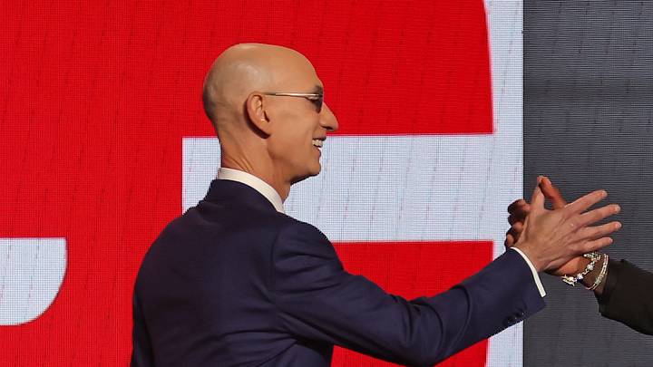 Jun 26, 2024; Brooklyn, NY, USA; Ron Holland II shakes hands with NBA commissioner Adam Silver after being selected in the first round by the Detroit Pistons in the 2024 NBA Draft at Barclays Center. Mandatory Credit: Brad Penner-USA TODAY Sports
