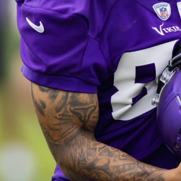 Jalen Nailor holding his helmet during a Vikings OTA practice. 