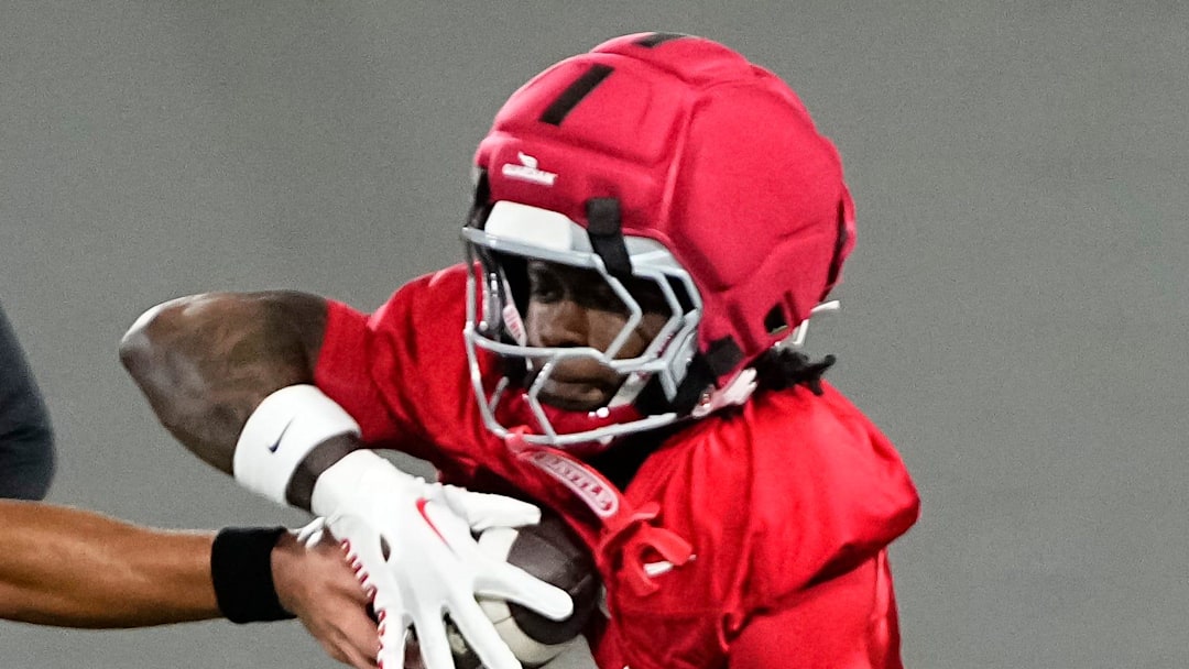 Ohio State Buckeyes quarterback Tavien St. Clair (9) hands off to running back Legend Bey (2) during the first day of spring workouts for the 2026 football season at Woody Hayes Athletic Complex in Columbus on March 10, 2026.