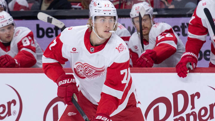 Jan 5, 2026; Ottawa, Ontario, CAN; Detroit Red Wings defenseman Simon Edvinsson (77) skates with the puck in the second period against the Ottawa Senators at the Canadian Tire Centre. Mandatory Credit: Marc DesRosiers-IMAGN Images
