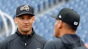 Cleveland Guardians top pitching prospect Daniel Espino, left, talks with Akron RubberDucks manager Rouglas Odor during the RubberDucks Media Day at Canal Park in Akron.
