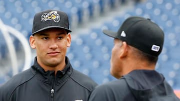 Cleveland Guardians top pitching prospect Daniel Espino, left, talks with Akron RubberDucks manager Rouglas Odor during the RubberDucks Media Day at Canal Park in Akron.