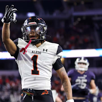 Hawk Patrick-Daniels celebrates one of his 3 TDs in Aledo's 51-8 UIL 5A-D1 state title repeat in Dec. 2023 at AT&T Stadium.