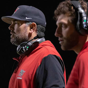 Aaron Huerta (left) is the new head football coach at Bishop Alemany High.