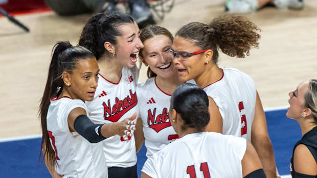 Members of the Husker Volleyball team celebrate