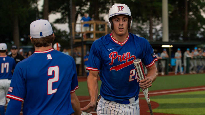 Jackson Prep Patriots' Konnor Griffin (22) high fives Gardner Young (2) after scoring a run during the game against the Presbyterian Christian Bobcats at Jackson Prep in Flowood, Miss., on Tuesday, May 14, 2024. Griffin is SBLive Sports' top-rated MLB Draft eligible high school baseball player.