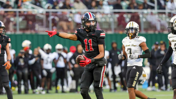 Daylan McCutcheon motions for a first down in a 2023 matchup with South Oak Cliff in a showdown of Texas high school powerhouses.