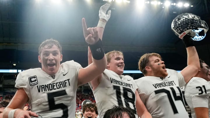 Austin Vandegrift players celebrate a win over San Antonio Harlan in the 2022 UIL (Texas) 6A Division II regional finals.