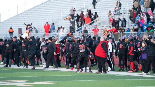 Spring Westfield's bench celebrates during a 2022 Texas high school football game. 