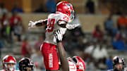 D'Andre Hardeman is lifted up in celebration by a teammate in North Shore's 2023 win over Westfield.