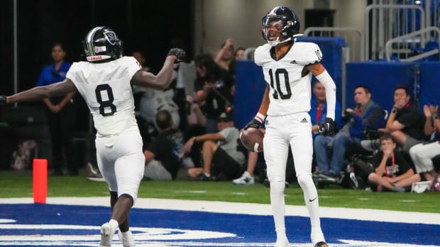 Cibolo-Steele's Jalen Cooper celebrates a touchdown in the endzone during the 2022 playoffs. 