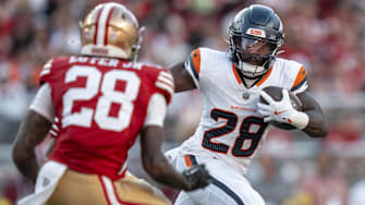 August 9, 2025; Santa Clara, California, USA; Denver Broncos running back Tyler Badie (28, right) runs the football against San Francisco 49ers cornerback Darrell Luter Jr. (28, left) during the second quarter at Levi's Stadium. 