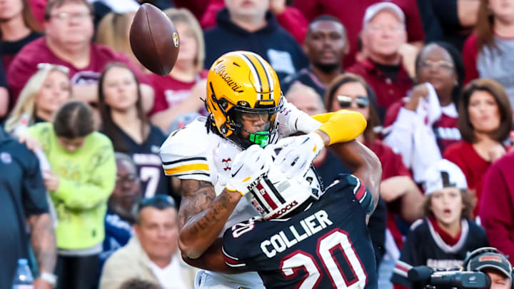 Nov 16, 2024; Columbia, South Carolina, USA; South Carolina Gamecocks defensive back Judge Collier (20) defends Missouri Tigers wide receiver Theo Wease Jr. (1) on an incomplete pass in the first quarter at Williams-Brice Stadium. Mandatory Credit: Jeff Blake-Imagn Images
