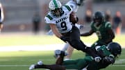 Southlake Carroll running back Riley Wormley fights for yards against DeSoto in the 6A Division II Texas state semifinals in 2023.