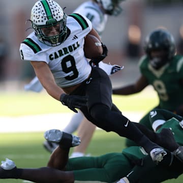 Southlake Carroll running back Riley Wormley fights for yards against DeSoto in the 6A Division II Texas state semifinals in 2023.