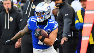 Nov 30, 2025; Seattle, Washington, USA; Seattle Seahawks wide receiver Jaxon Smith-Njigba (11) runs the ball after a catch during the second half against the Minnesota Vikings at Lumen Field. Mandatory Credit: Steven Bisig-Imagn Images