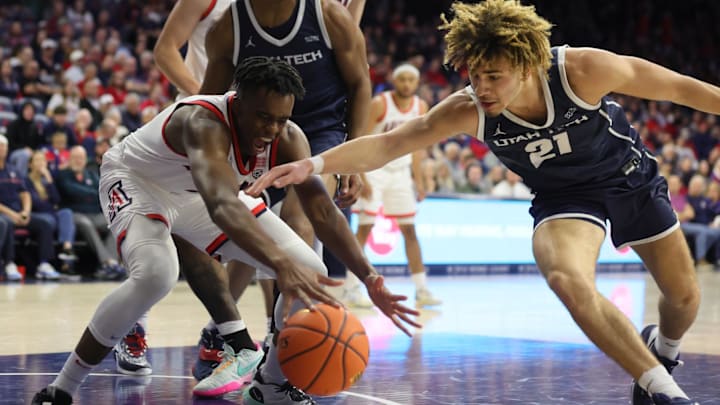 Nov 17, 2022; University of Arizona Wildcats guard Adama Bal (2) fights for a rebound against Utah Tech guard Isaiah Pope (21) in the first half. Tucson, Arizona, USA; at McKale Center. Mandatory Credit: David Cruz-Imagn Images