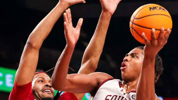 South Carolina Gamecocks forward Collin Murray-Boyles shoots over Arkansas Razorbacks forward Jonas Aidoo in the first half a
