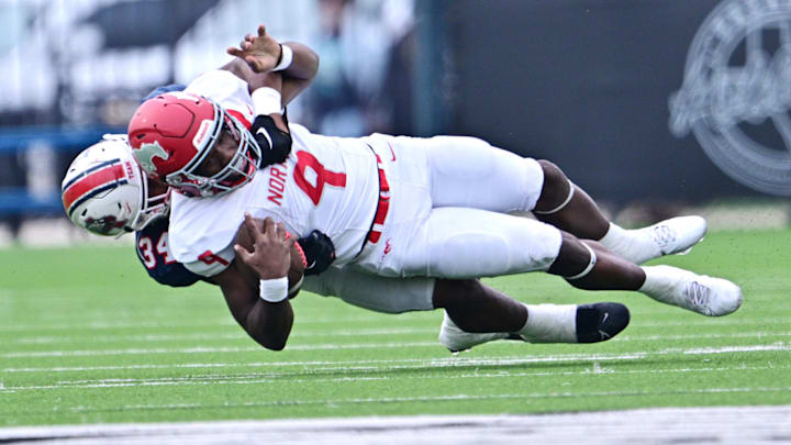 North Shore QB Kaleb Bailey is taken down during a showdown with Atascocita in 2023.