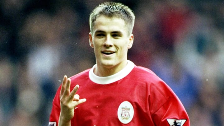 Michael Owen of Liverpool shows four fingers for four goals