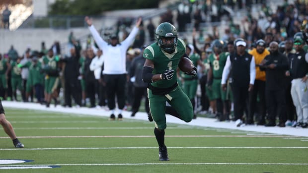 Deondrae Riden barrels toward the endzone in a 6A Division II Texas state semifinal win over Southlake Carroll in Nov. 2023.